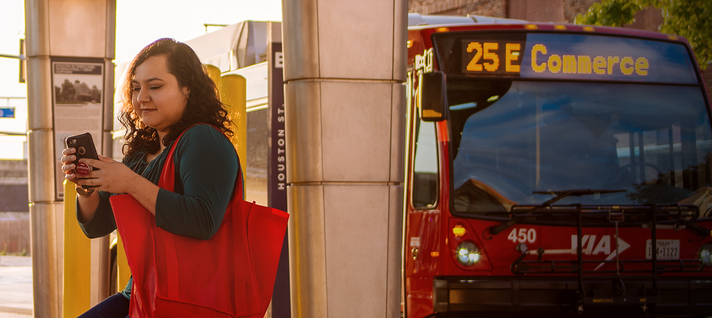 Woman looking out the window on the VIA bus.
