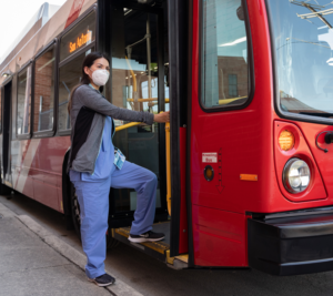 Image: VIA rider with mask board bus