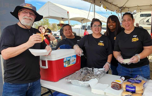 VIA president and CEO Jeff Arndt and volunteers at GrillsGiving