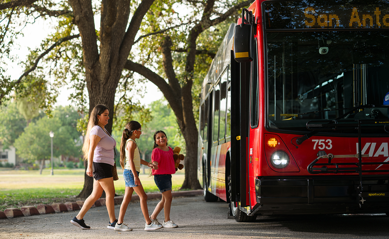 VIA Riders boarding a bus